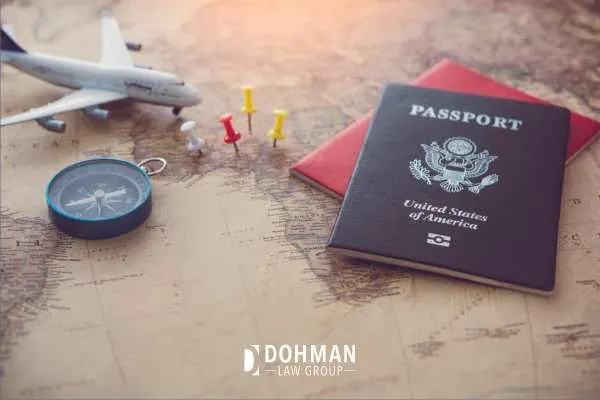 passports and a model plane on a map