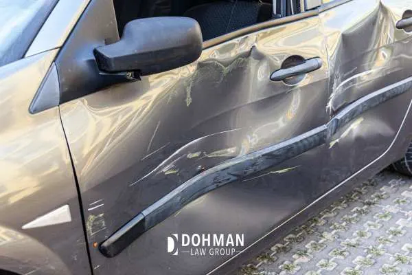 a photo of the side of a car after being damaged in a hit and run
