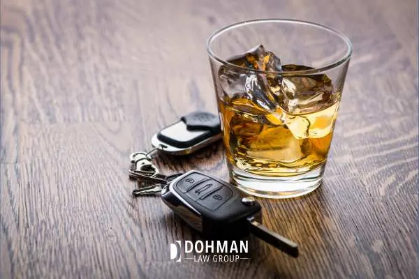 a table with alcohol and car keys on it