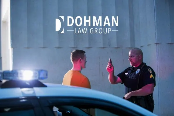 a police officer giving a man a field sobriety test