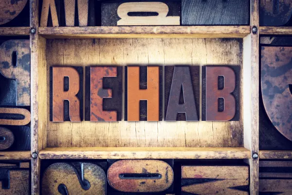 a sign that reads "REHAB"