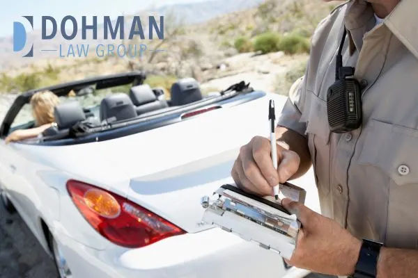 a police officer citing a ticket to a driver