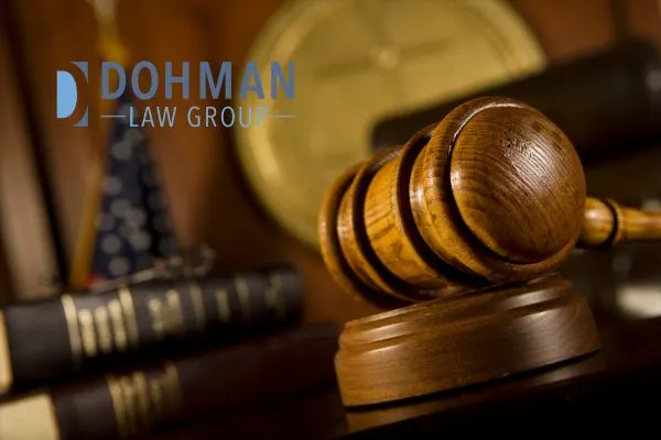 a judge's gavel and books sitting at their stand