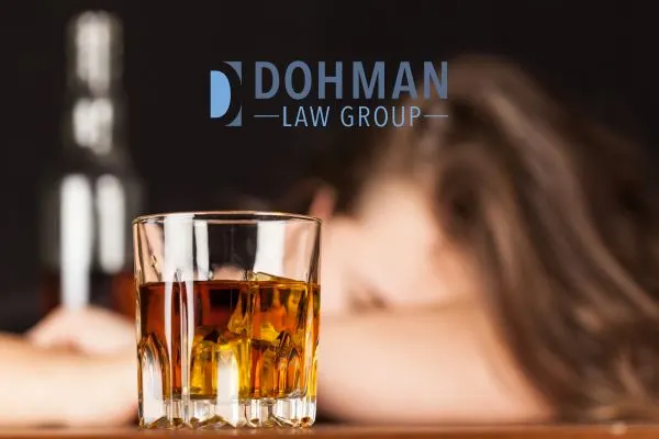 a woman sitting at a bar with a glass of whiskey