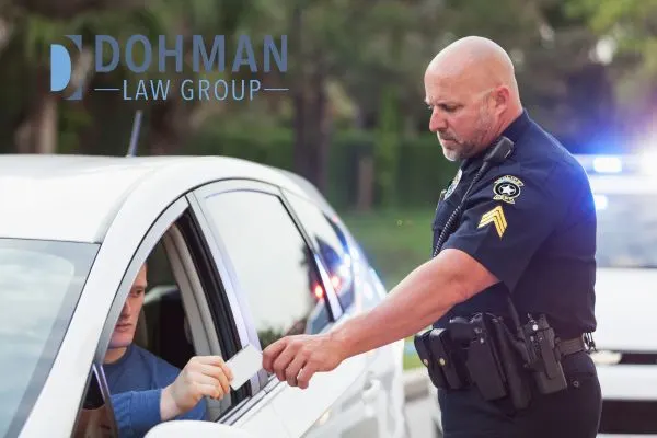 a police officer taking a person's ID during a traffic stop