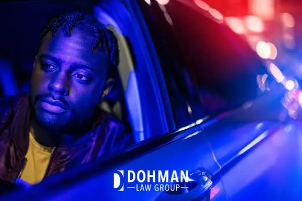 a man being stopped by the police while driving