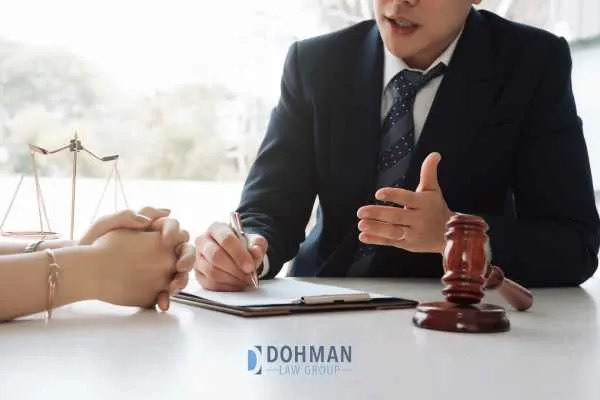 a woman meeting with a DUI attorney