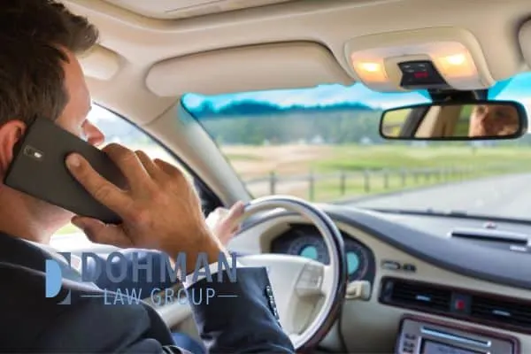 a man using his phone while driving in Illinois