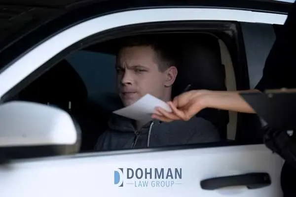 a man being given a traffic ticket