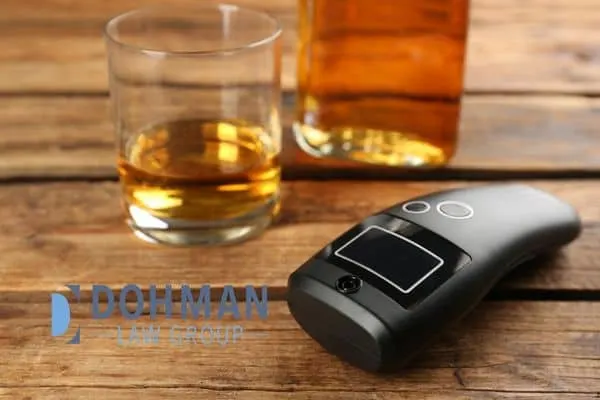 breathalyzer on a table next to alcohol, Breathalyzer Inaccuracies