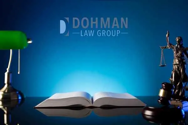 lamp, gavel, statue, and book on a desk, Statutory License Suspension in Illinois
