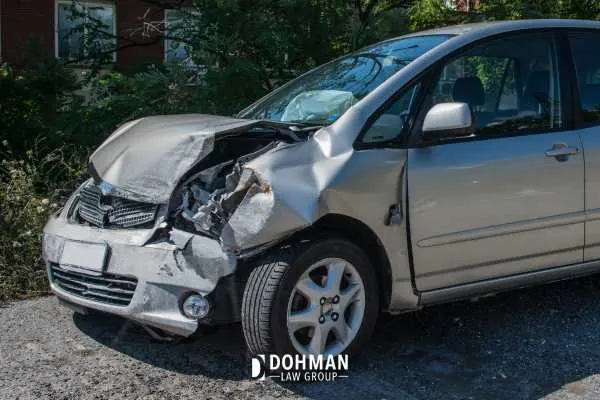 a car with extensive damage to the front end from an accident