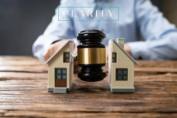 a gavel splitting a model home in half