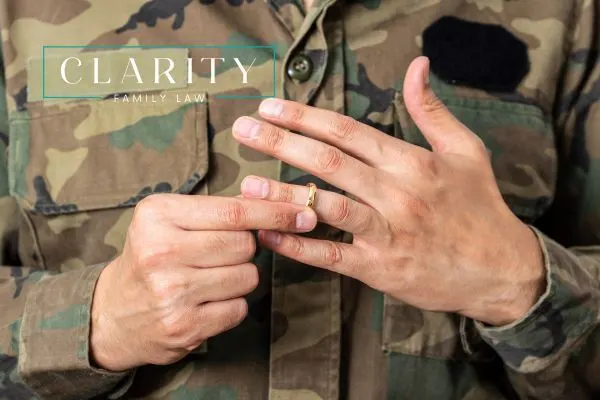 a military person taking off their wedding ring