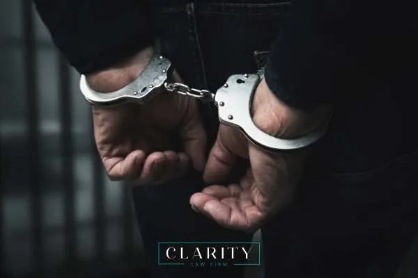 a handcuffed man being charged with manslaughter