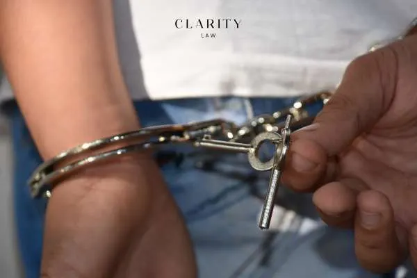 a minor in handcuffs after committing a crime