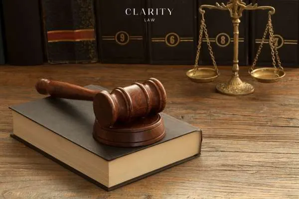 legal books, scales, and a gavel on an attorneys desk