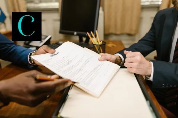 two lawyers discussing divorce paper work