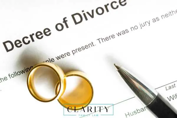 Michigan decree of divorce with wedding bands on top