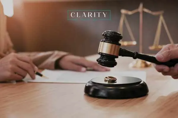 a woman signing a divorce form