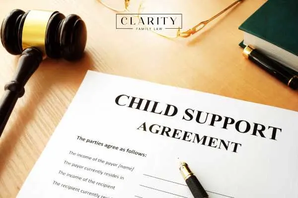 a child support form and gavel on a lawyers desk