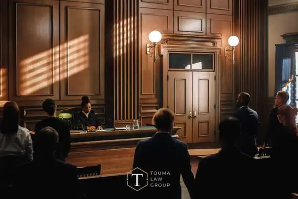 A group of people inside a courtroom.