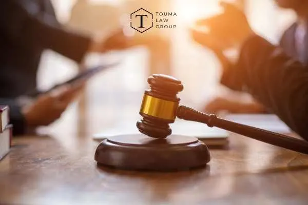 a defense attorney discussing domestic violence charges with a client