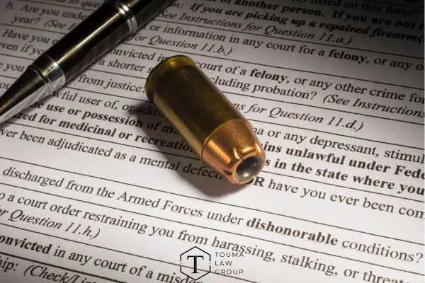 a legal form covering dishonorable discharge and a pen on a table