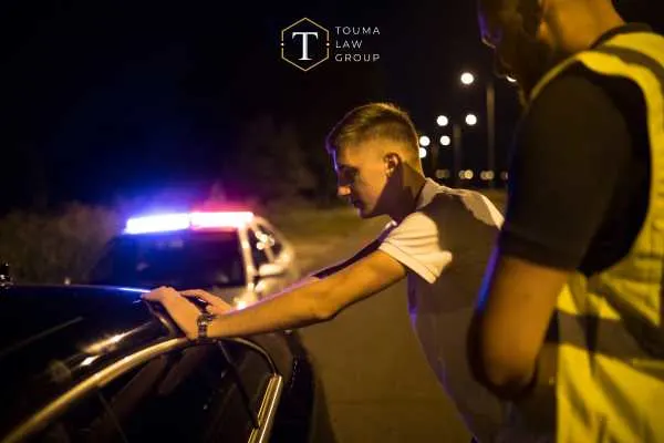 a man being arrested for drunk driving