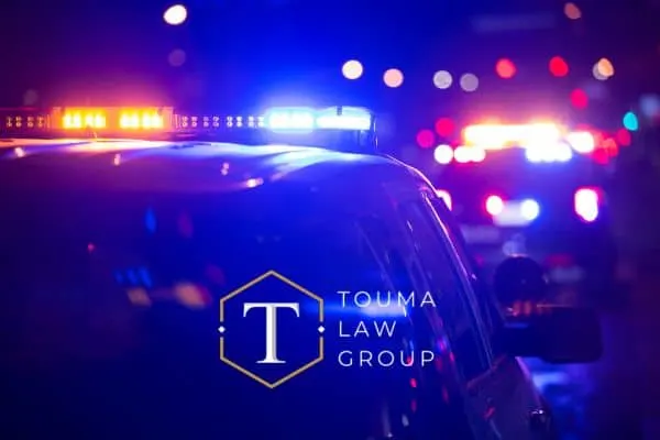 blurred image of police car lights at night.