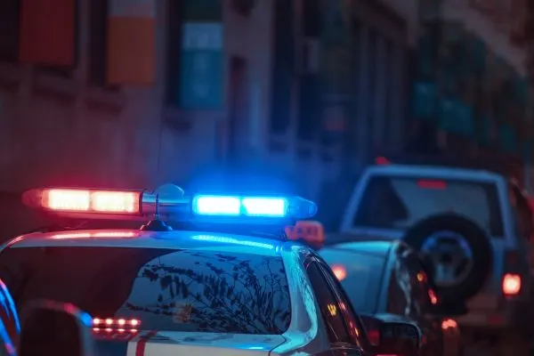 police car with lights on pulled over