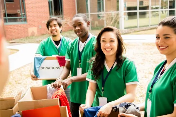A group of volunteers sorting donation boxes.
