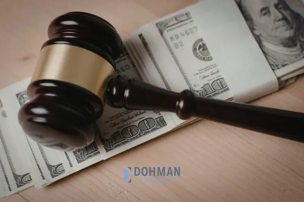 Judges gavel on top of a stack of bills