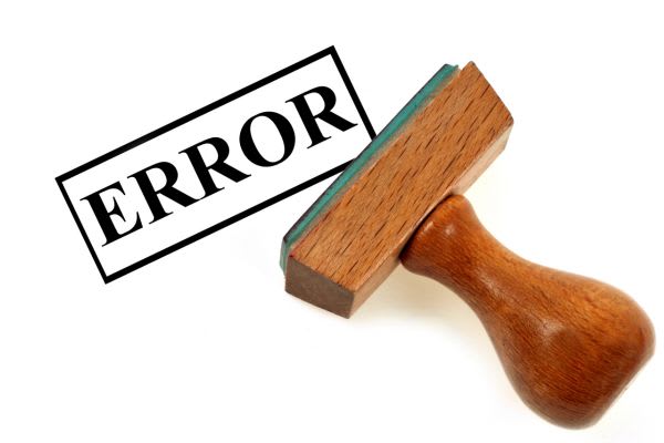 shorter A rubber stamp next to a black "ERROR" stamp impression on a white background.