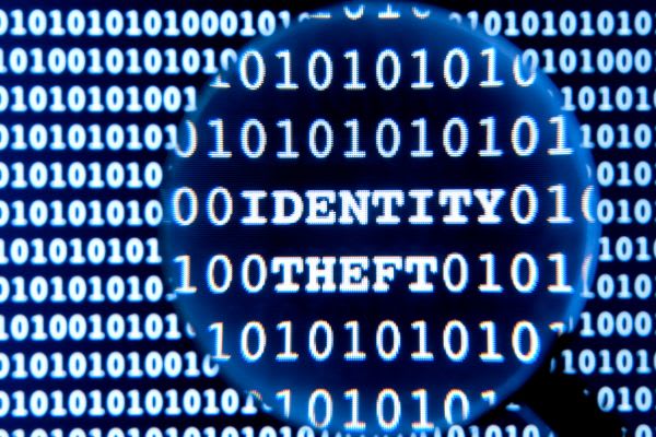 Magnifying glass on the word identity theft