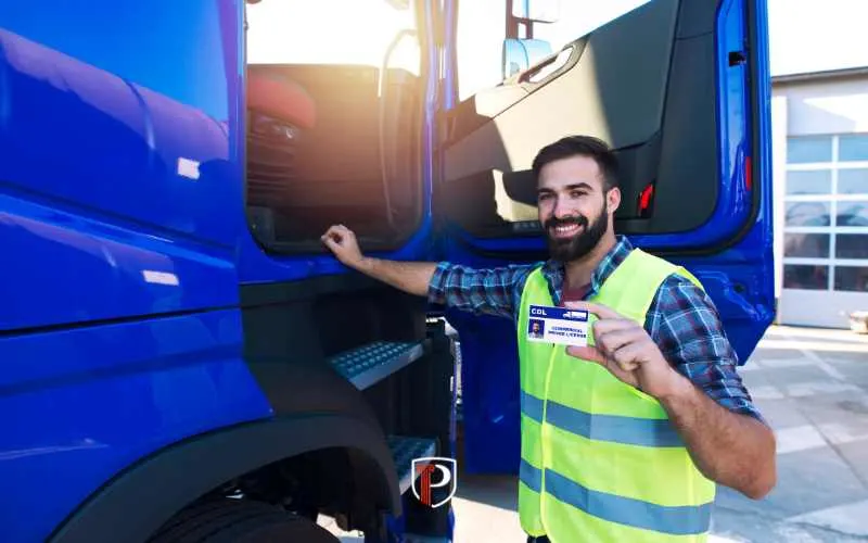 a man next to a commercial vehicle with a CDL