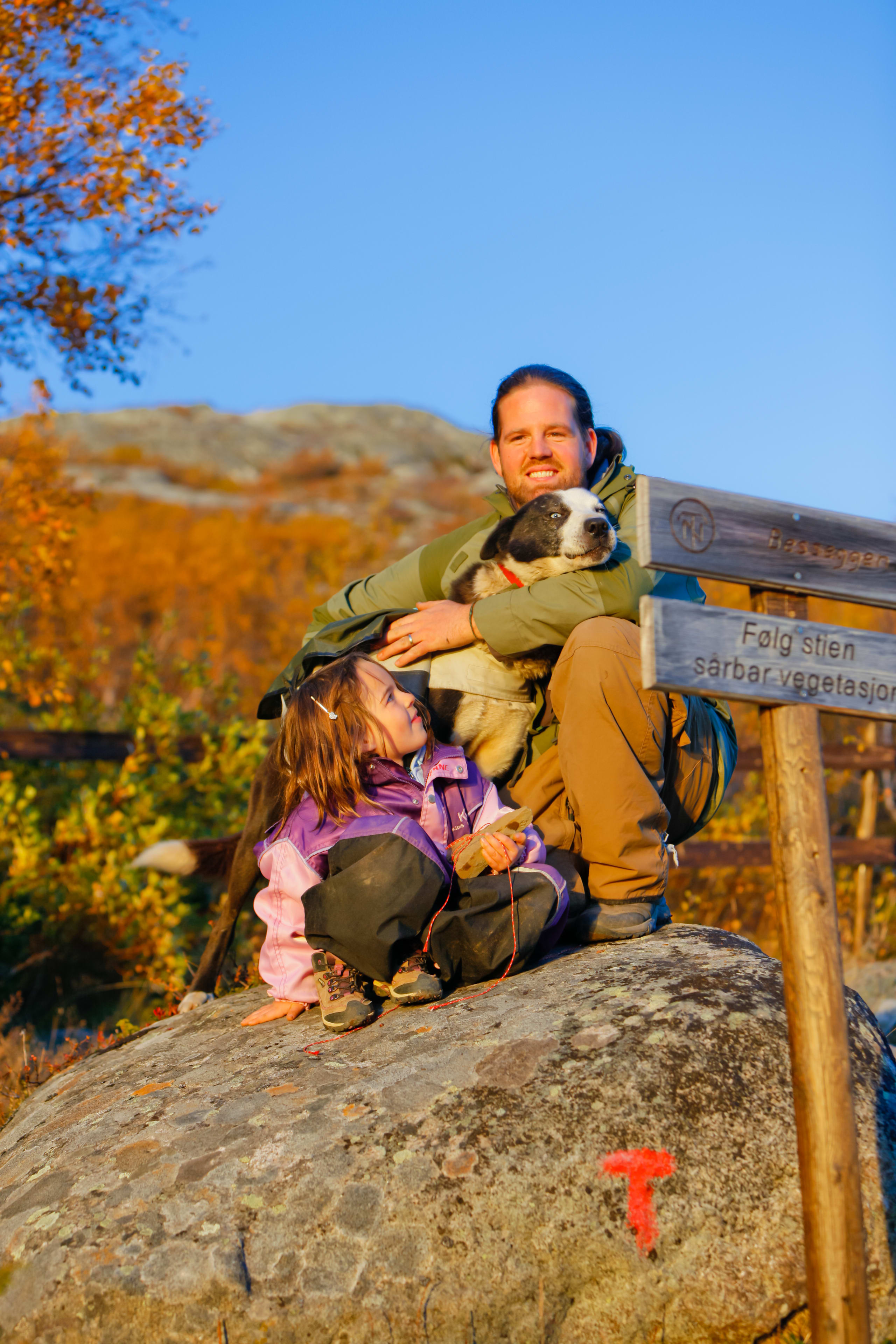 Happy family on a mountain hike in Jotunheimen