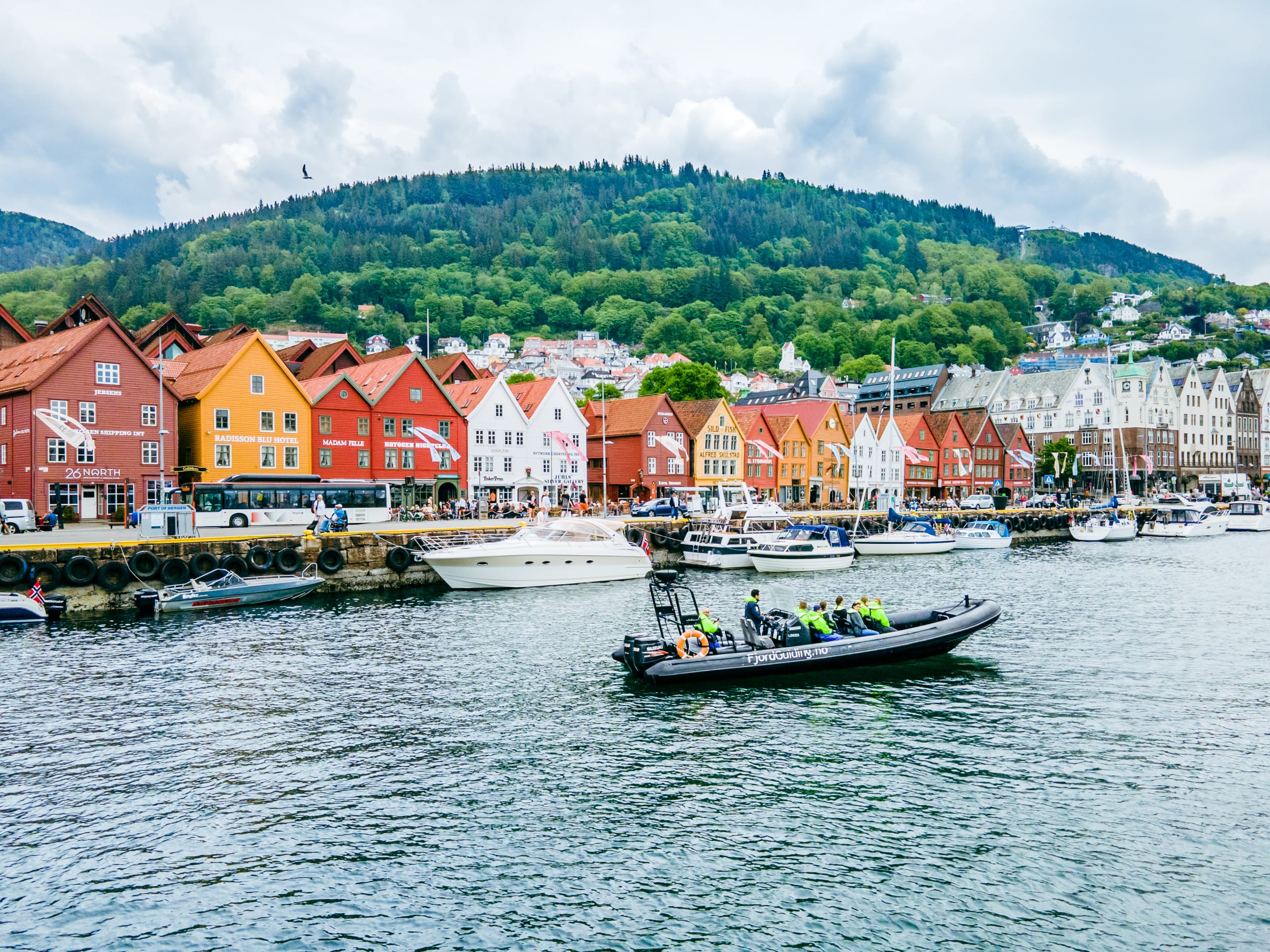 RIB boat cruising in Vågen in front of Bryggen Wharf