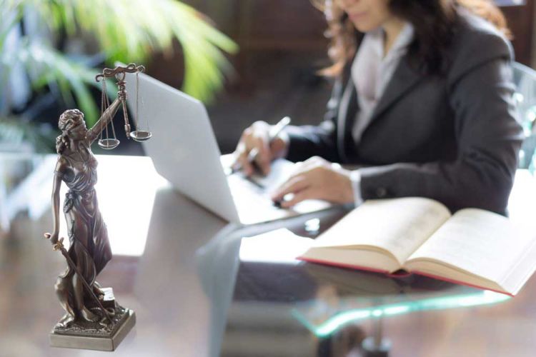 Legal scales weighing business liability