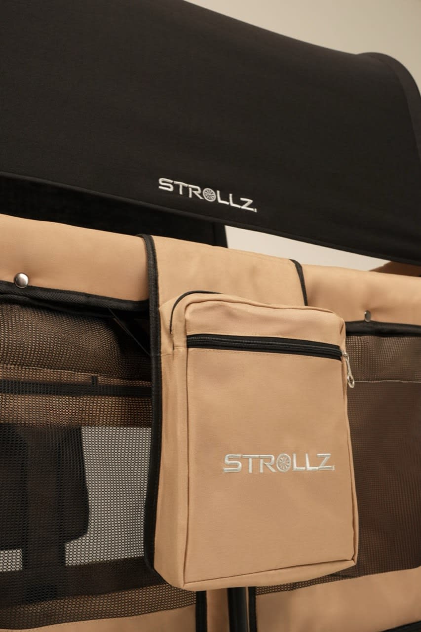 Close-up of the STROLLZ. stroller wagon front storage pocket, providing convenient storage for everyday family essentials.