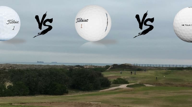 Drei Titleist-Golfbälle auf ei...