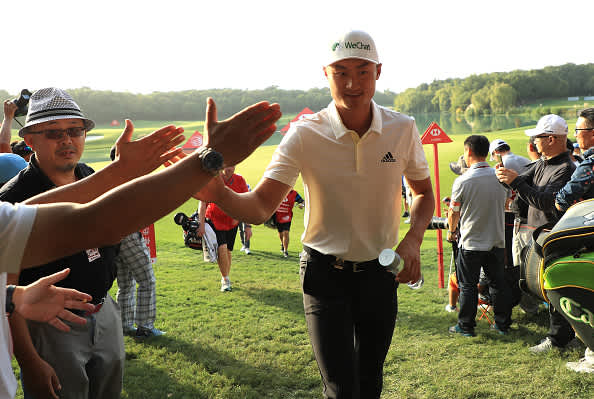 SHANGHAI, CHINA - OCTOBER 31:  Haotong Li of China walks off the 9th green after his round during Day one of the WGC HSBC Champions at Sheshan International golf club on October 31, 2019 in Shanghai, China. (Photo by Matthew Lewis/Getty Images)