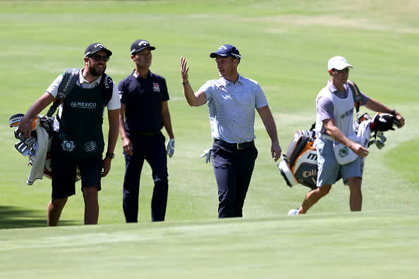 MEXICO CITY, MEXICO - FEBRUARY 21: Danny Willett of England and Kevin Na of the United States walk on the first hole during the second round of the World Golf Championships Mexico Championship at Club de Golf Chapultepec on February 21, 2020 in Mexico City, Mexico. (Photo by Rob Carr/Getty Images)