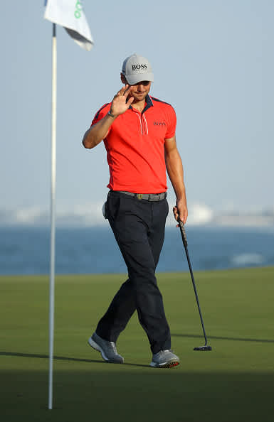 MUSCAT, OMAN - FEBRUARY 28: Martin Kaymer of Germany acknowledges the crowd on the 18th green during Day 2 of the Oman Open at Al Mouj Golf Complex on February 28, 2020 in Muscat, Oman. (Photo by Warren Little/Getty Images)