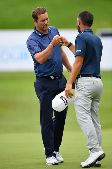 ATZENBRUGG, AUSTRIA - JULY 12: Marc Warren of Scotland is congratulated by Sebastian Garcia Rodriguez of Spain on the 18th green after winning the Austrian Open at Diamond Country Club on July 12, 2020 in Atzenbrugg, Austria. (Photo by Stuart Franklin/Getty Images)