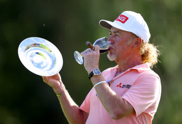 BIRMINGHAM, ENGLAND - JULY 30: Miguel Angel Jimenez of Spain poses with a award and drinking a glass of wine after making his 707th European tour start, a tour appearance record during Day One of the Hero Open at Marriott Forest of Arden on July 30, 2020 in Birmingham, England. (Photo by Richard Heathcote/Getty Images)