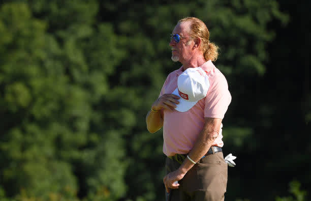 BIRMINGHAM, ENGLAND - JULY 30: Miguel Angel Jimenez of Spain waves his hat to players and staff who applaud him off the 18th green as he makes his 707th European tour start, a tour appearance record during Day One of the Hero Open at Marriott Forest of Arden on July 30, 2020 in Birmingham, England. (Photo by Ross Kinnaird/Getty Images)