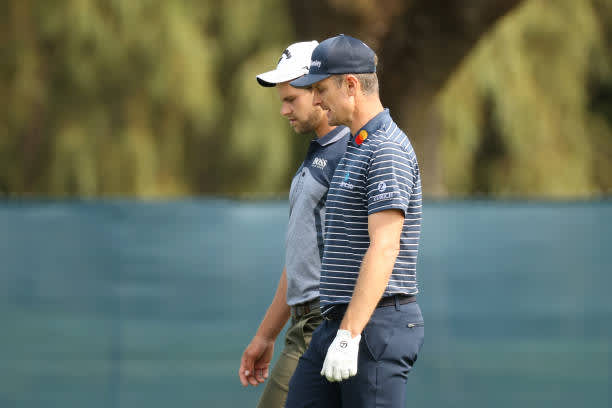 MAMARONECK, NEW YORK - SEPTEMBER 15: Thomas Detry of Belgium walks with Justin Rose of England during a practice round prior to the 120th U.S. Open Championship on September 15, 2020 at Winged Foot Golf Club in Mamaroneck, New York. (Photo by Gregory Shamus/Getty Images)