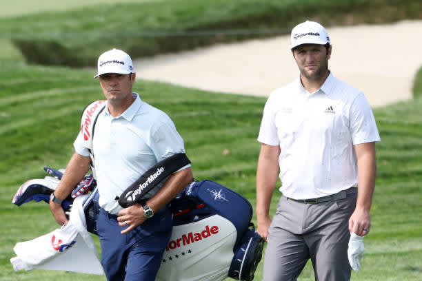 MAMARONECK, NEW YORK - SEPTEMBER 15: Jon Rahm (R) of Spain walks with caddie Adam Hayes (L) during a practice round prior to the 120th U.S. Open Championship on September 15, 2020 at Winged Foot Golf Club in Mamaroneck, New York. (Photo by Jamie Squire/Getty Images)