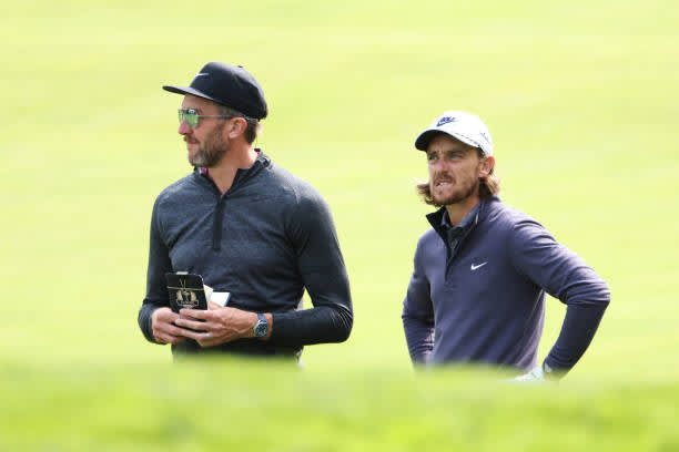 MAMARONECK, NEW YORK - SEPTEMBER 15: Tommy Fleetwood of England waits with caddie Ian Finnis (L) during a practice round prior to the 120th U.S. Open Championship on September 15, 2020 at Winged Foot Golf Club in Mamaroneck, New York. (Photo by Jamie Squire/Getty Images)